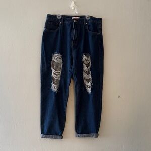Woman Distressed Blue Jeans